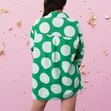 Green shirt with white dots