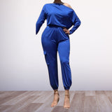 Versatile Asymmetrical Jumpsuit Available in Vibrant Fuchsia, Bold Blue, Classic Black, and Lush Green